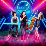 Three members of Take3 pose with their instruments.